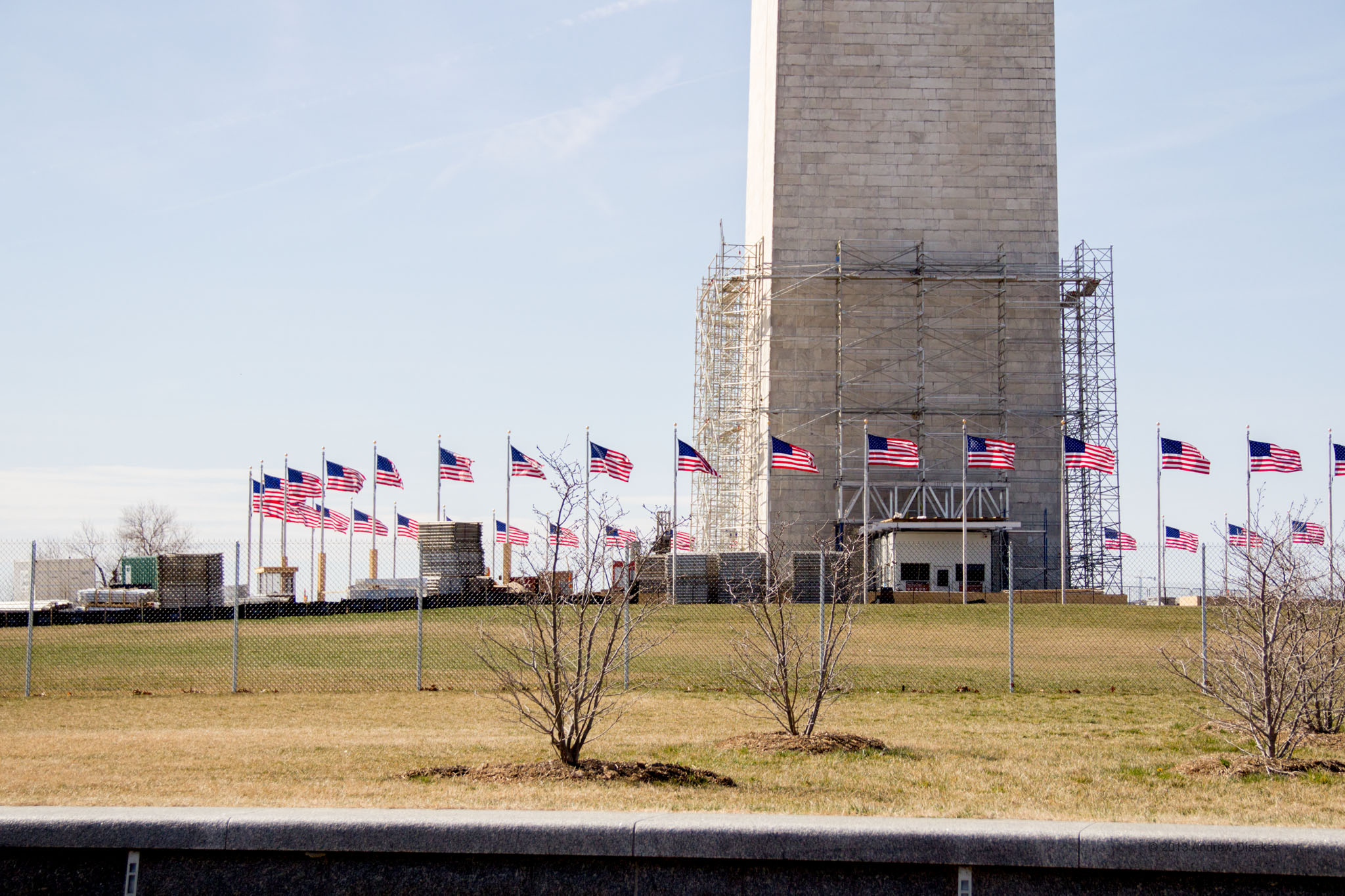 base of the Washington Monument with flags and scaffolding
