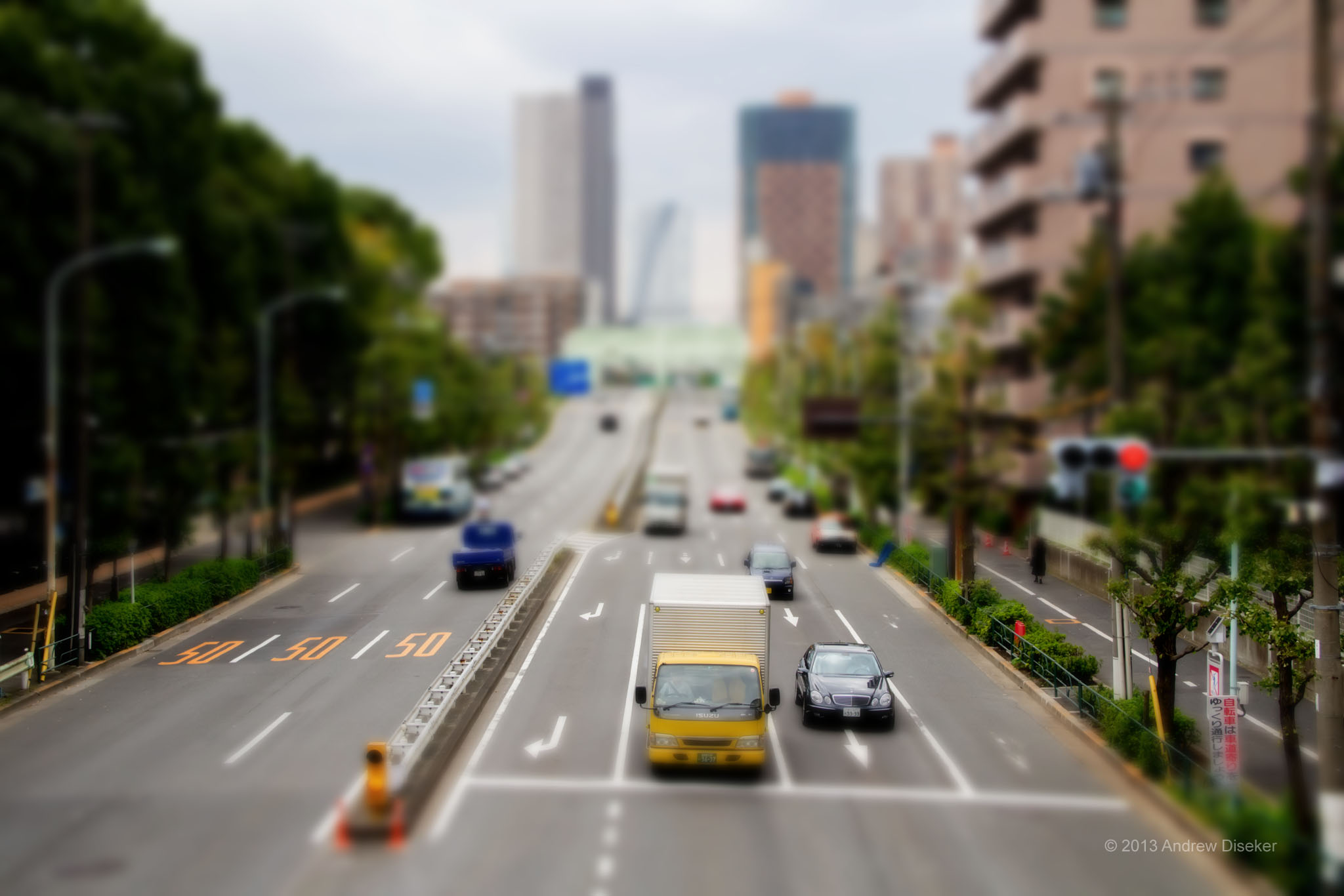 simulated tilt-shift processed photo of cars on highway taken from overhead